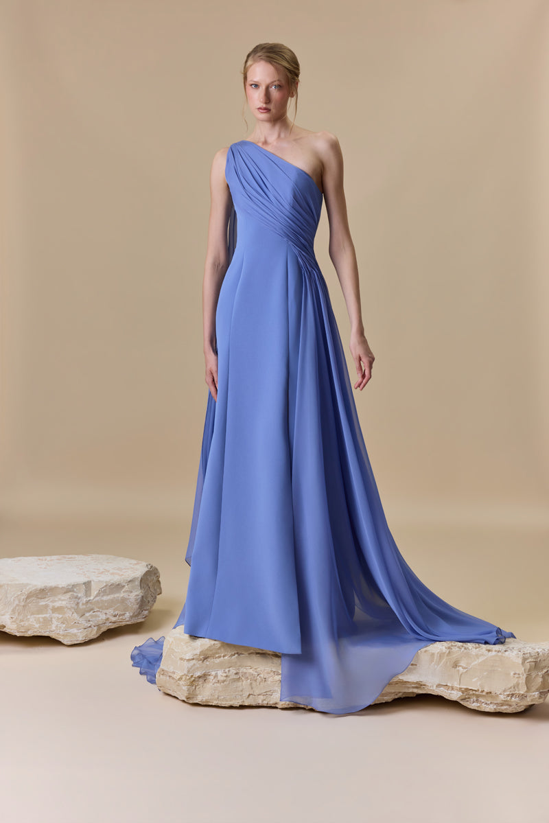 An asymmetrical one shoulder crepe dress with chiffon drapings.