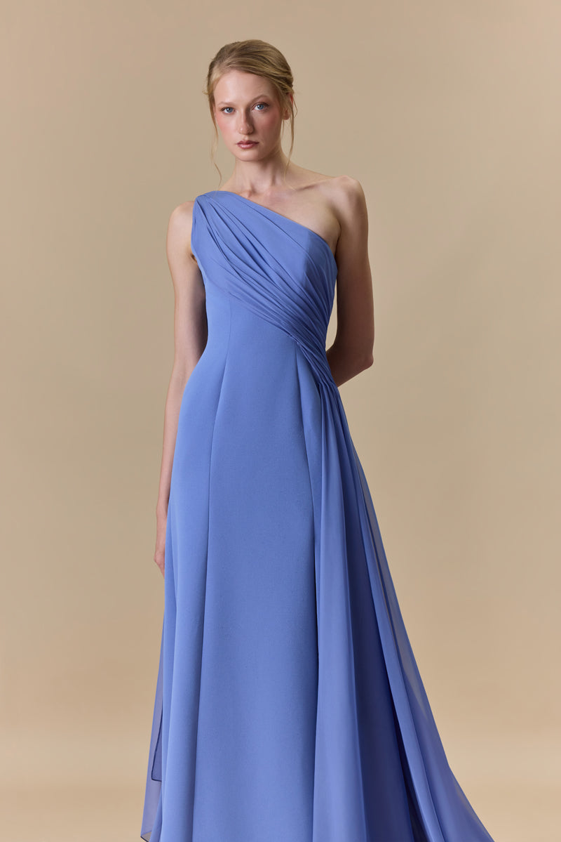 An asymmetrical one shoulder crepe dress with chiffon drapings.