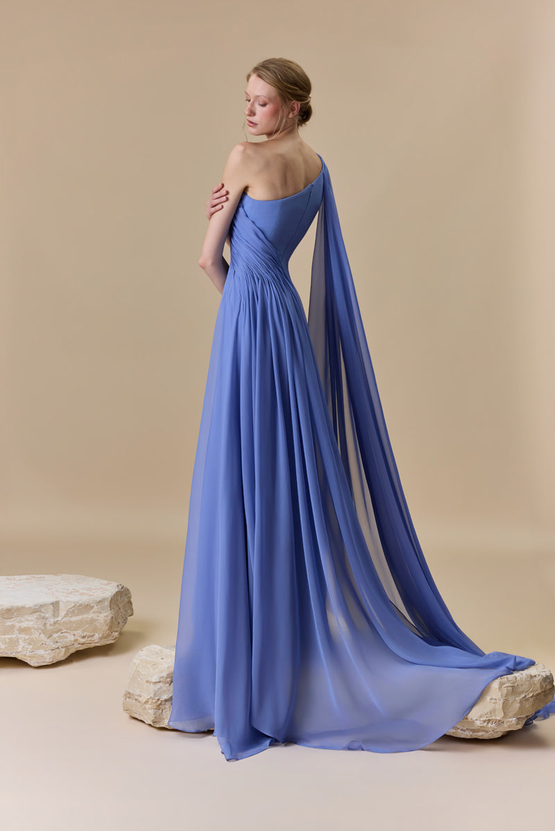 An asymmetrical one shoulder crepe dress with chiffon drapings.