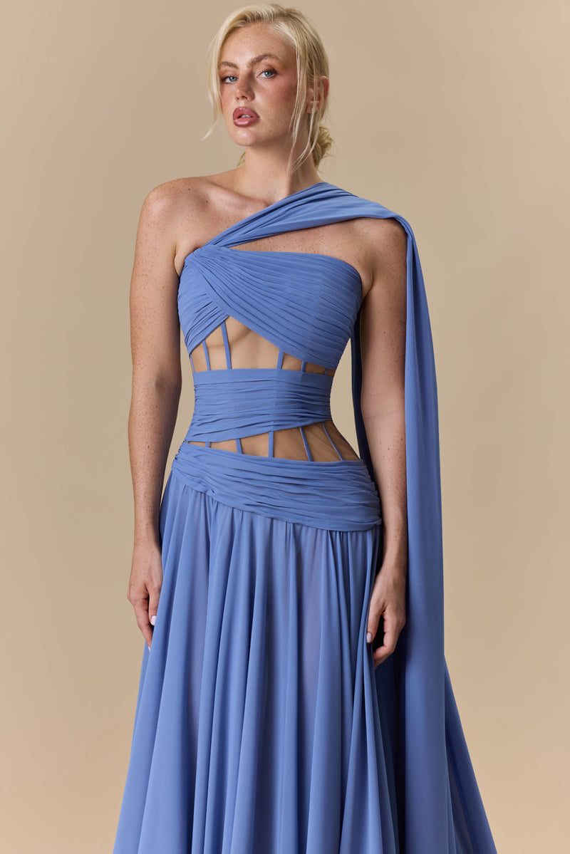 A strapless georgette A line dress with horizontal drapes across the bodice, and a soft flowing floor-length skirt.
