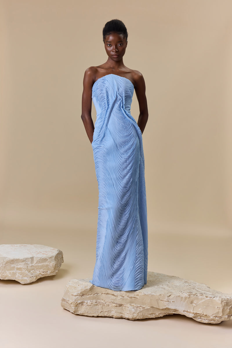 A strapless fitted dress made from shredded chiffon.
