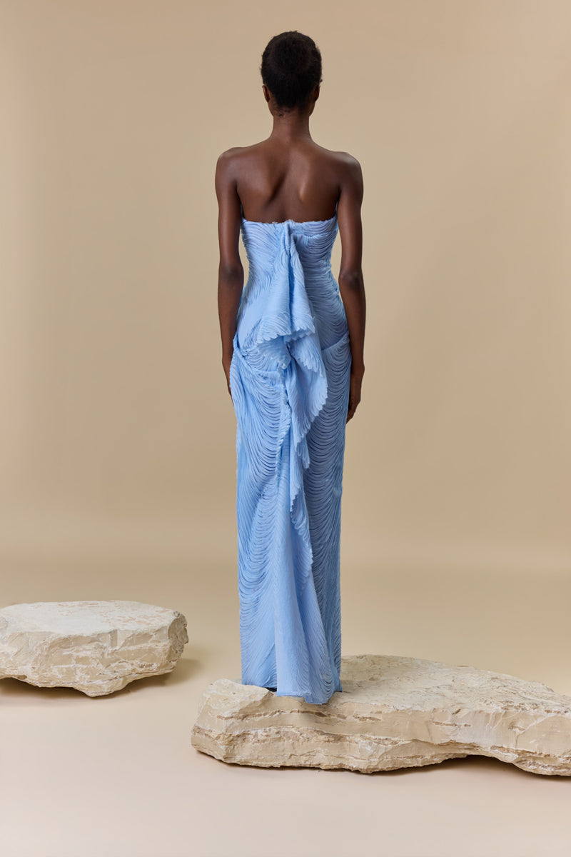 A strapless fitted dress made from shredded chiffon.