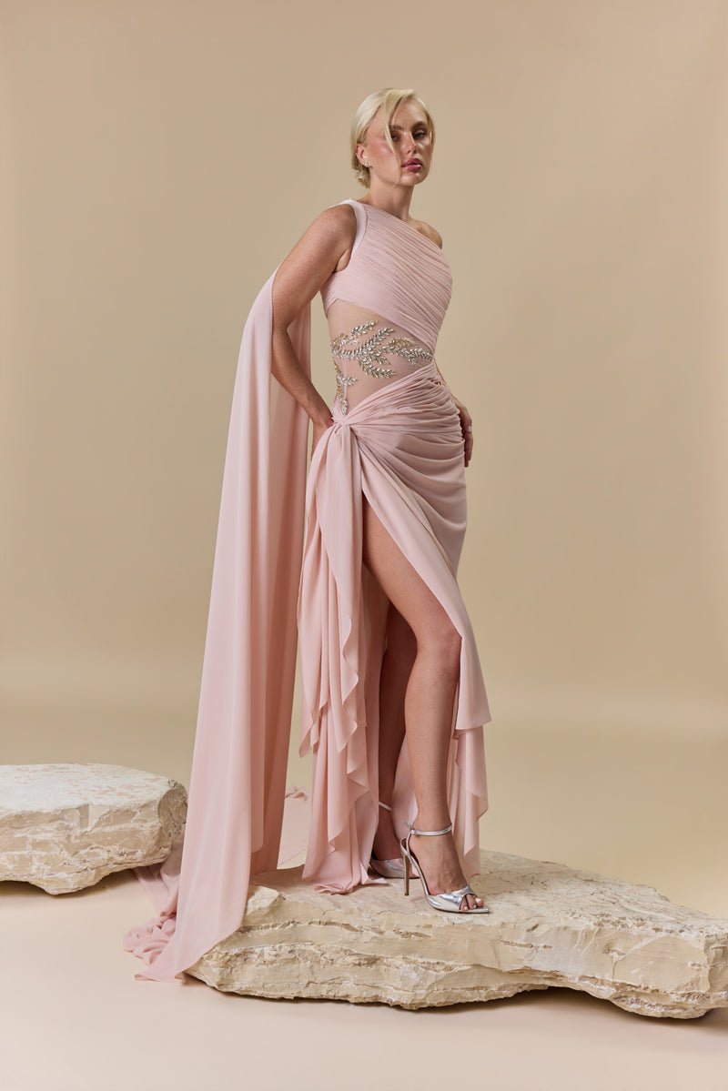 A draped one-shoulder georgette gown with asymmetric draping and a beaded waist embellished with crystals and stones.