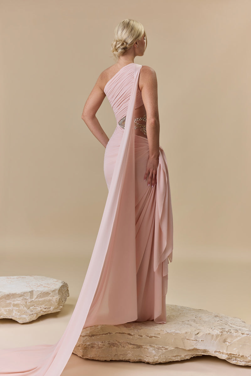 A draped one-shoulder georgette gown with asymmetric draping and a beaded waist embellished with crystals and stones.