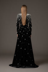 Black velvet dress with crystal and pearl embroidery paired with an overskirt‭