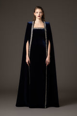 Embroidered velvet blue dress paired with a cape‭