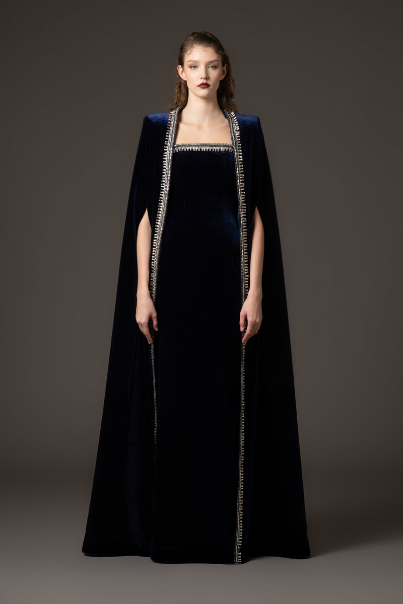 Embroidered velvet blue dress paired with a cape‭