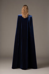 Embroidered velvet blue dress paired with a cape‭