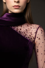 Velvet burgundy dress with crystal embroidery paired with a one-sided cape