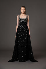 Fully embroidered black dress with overskirt.