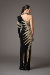 Asymmetrical black crepe dress with embroidered leaves in glass beads, bugle beads, and crystals back view