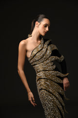 Black asymmetrical crepe dress with embroidered leaves in glass beads, bugle beads, and crystals close up