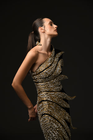 Black asymmetrical crepe dress with embroidered leaves in glass beads, bugle beads, and crystals close up