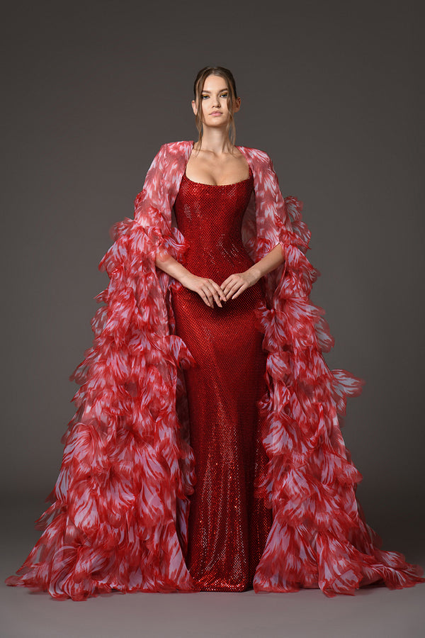 Red corseted dress with cape of laser-cut organza flower petals