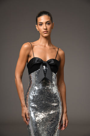 Grey sequined dress with a bow detailing on the bust