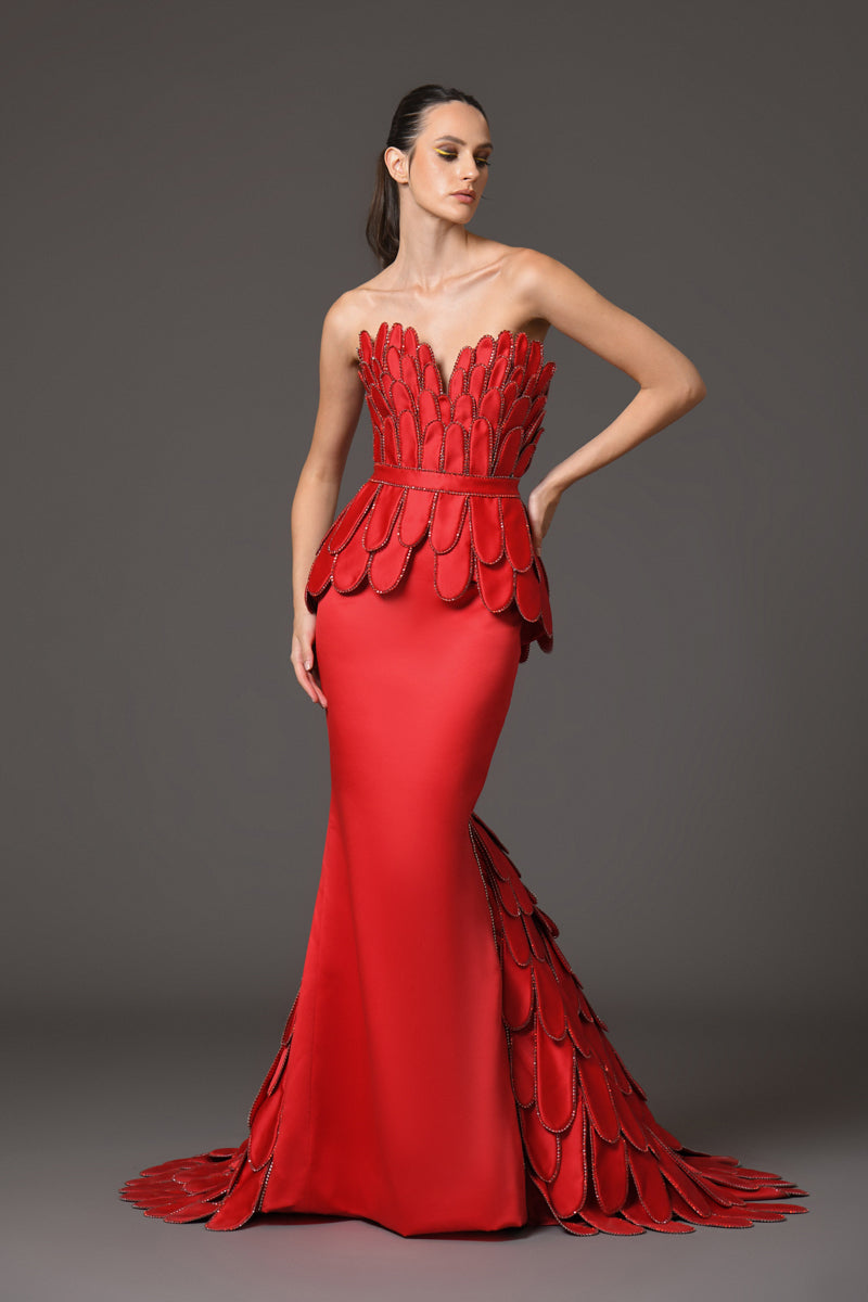 Red dress with hand crafted plumes in scuba and crystals on the corset and train