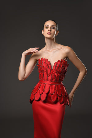 Red dress with hand crafted plumes in scuba and crystals on the corset and train close up