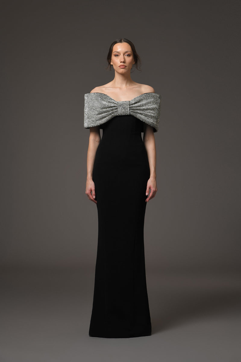 Black crêpe dress featuring a crystal bow