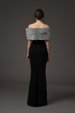 Black crêpe dress featuring a crystal bow