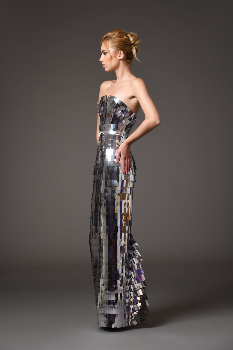A futuristic dress with layers of laser-cut silver mirror