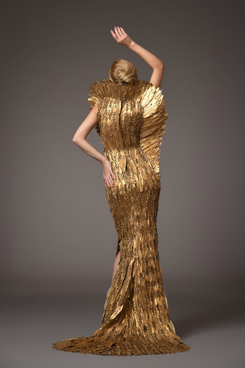 Golden feather gown with embroidery on feathers and a winged standing collar with train in back