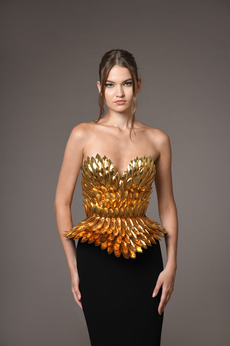 Armor gold-plated corset hand-crafted from solid brass paired with a black silk crpe skirt Armor gold-plated corset hand-crafted from solid brass paired with a black silk crpe skirt