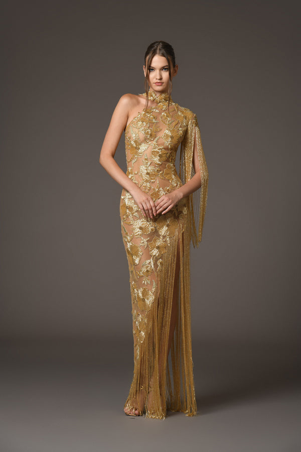 An Asymmetric dress featuring intricate floral patterns embroidered with shimmering gold beads