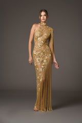 Assymetrical dress with floral patterns embroidered with gold beads