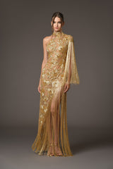 Assymetrical dress with floral patterns embroidered with gold beads