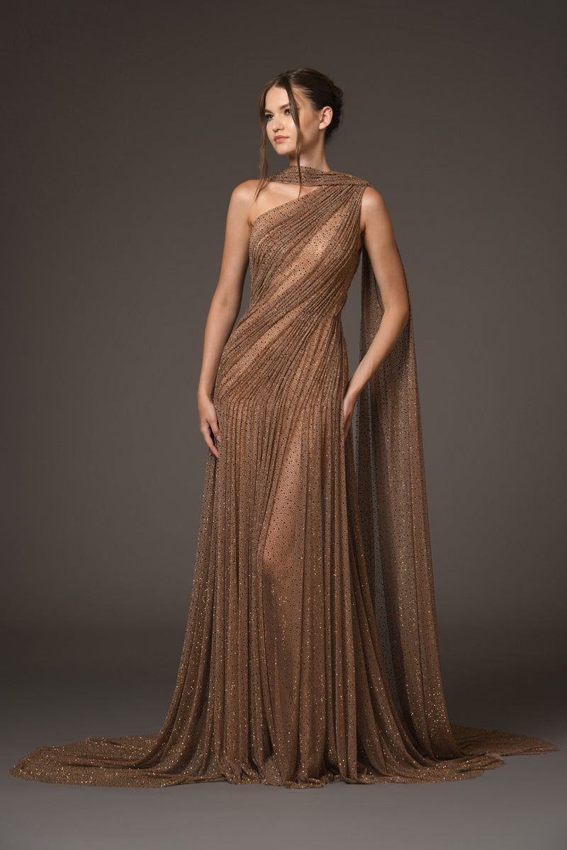 Asymmetrical halter gown draped in bronze tulle, with antique gold crystals