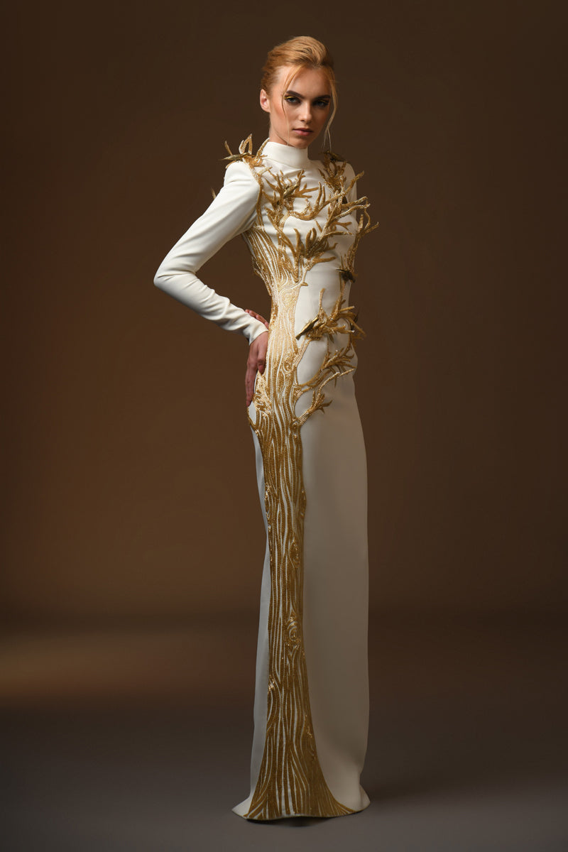 side view white crepe dress with golden tree and branches coming out of it and brass birds long sleeve