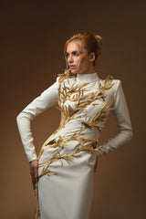 close up white crepe dress with golden branches coming out of it and brass birds long sleeve