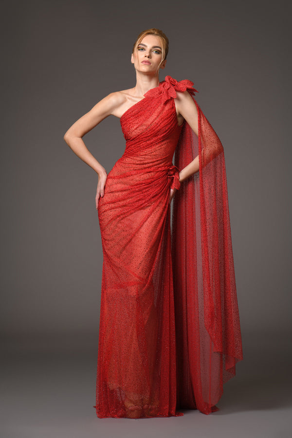 Draped asymmetrical tulle gown with ruby red crystals and flower detailing