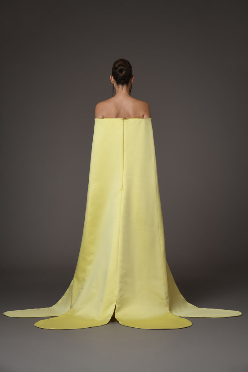 A corseted yellow gown with a cape back view