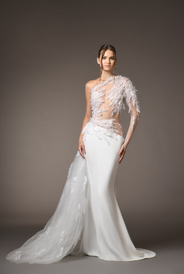 A white silk bridal crêpe gown embroidered with plumes crafted in hand-cut silk organza