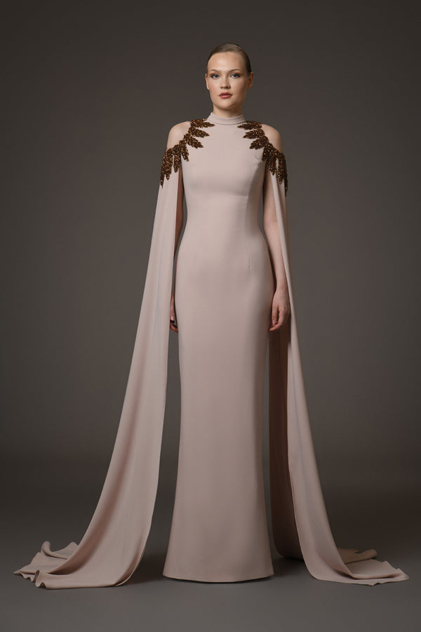 Nude crêpe dress with embroidery paired with cape sleeves