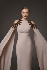 Nude crêpe dress with embroidery paired with cape sleeves