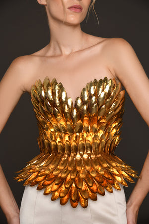 Armor gold-plated bustier in hand-crafted brass plumes paired with a duchesse satin mermaid skirt