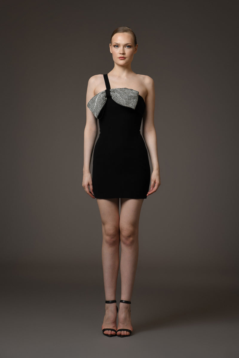 Short black crêpe dress featuring a crystal bow