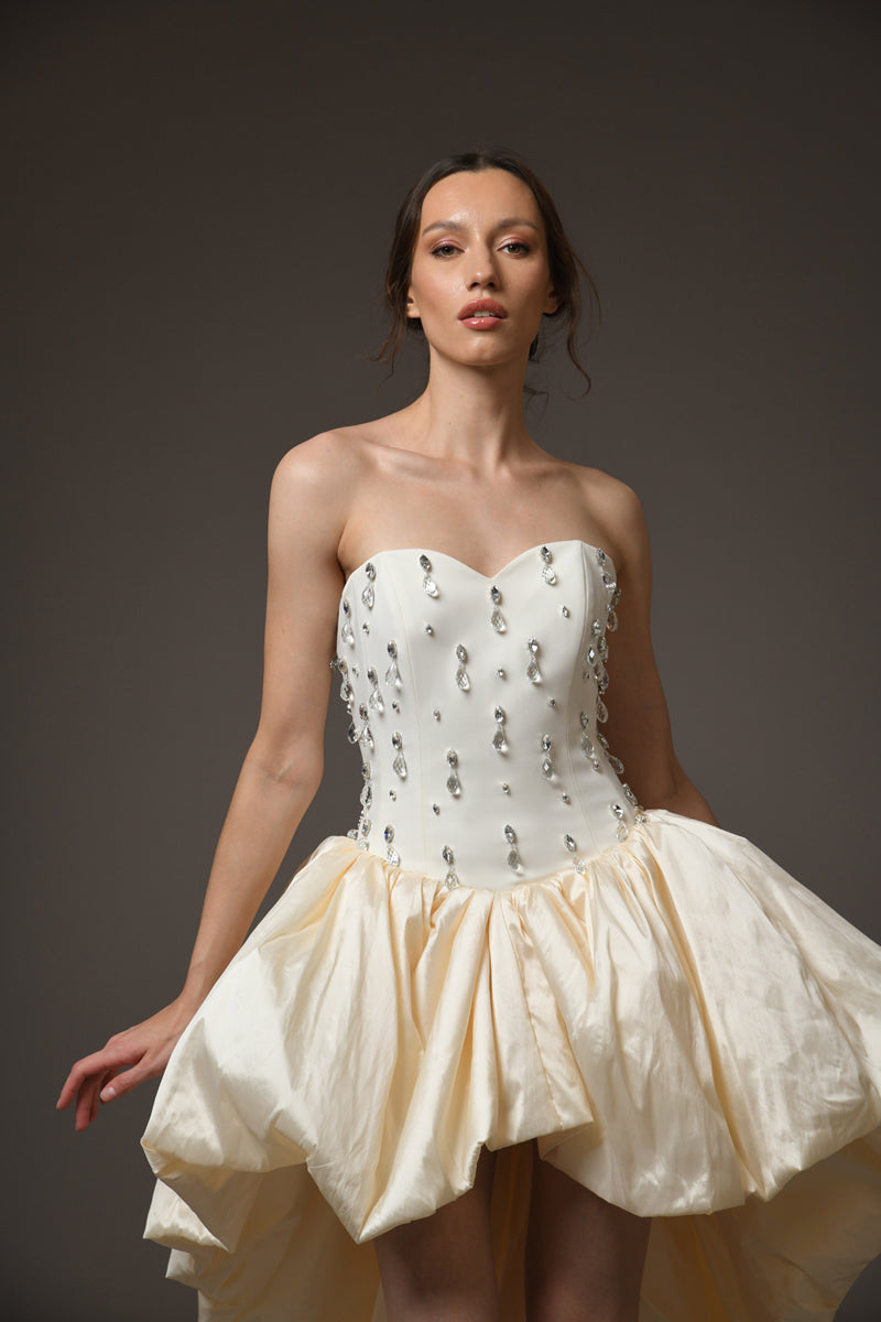 Ivory corseted short crêpe dress with a taffeta skirt and embroidery