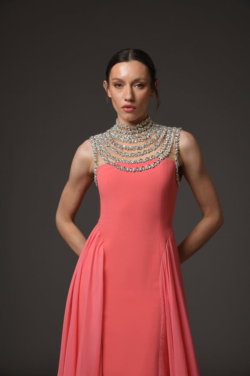 Coral crêpe dress with an embroidered neckline and a chiffon overskirt