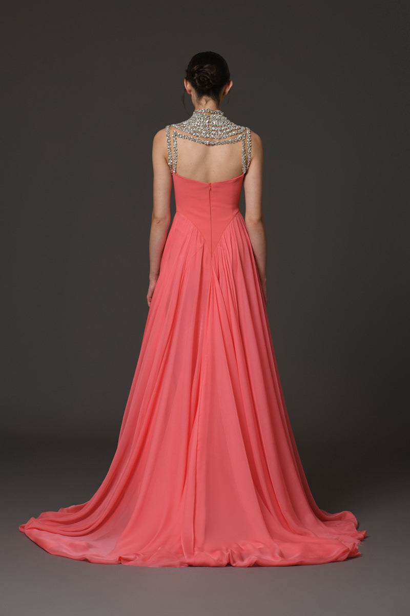 Coral crêpe dress with an embroidered neckline and a chiffon overskirt