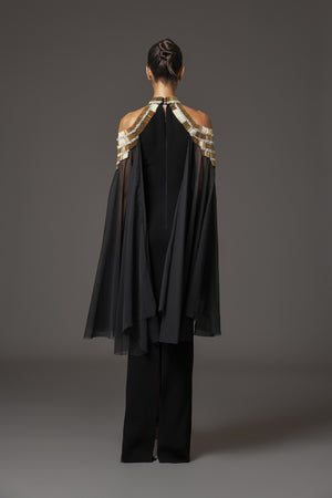 Black crêpe dress with embroidery and cape sleeves