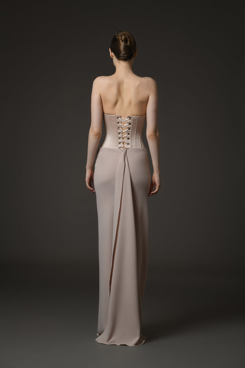 Nude corseted crêpe dress with exquisite draping