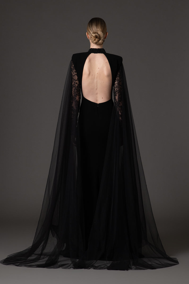 Black crêpe dress with embroidered detailing and cape sleeves