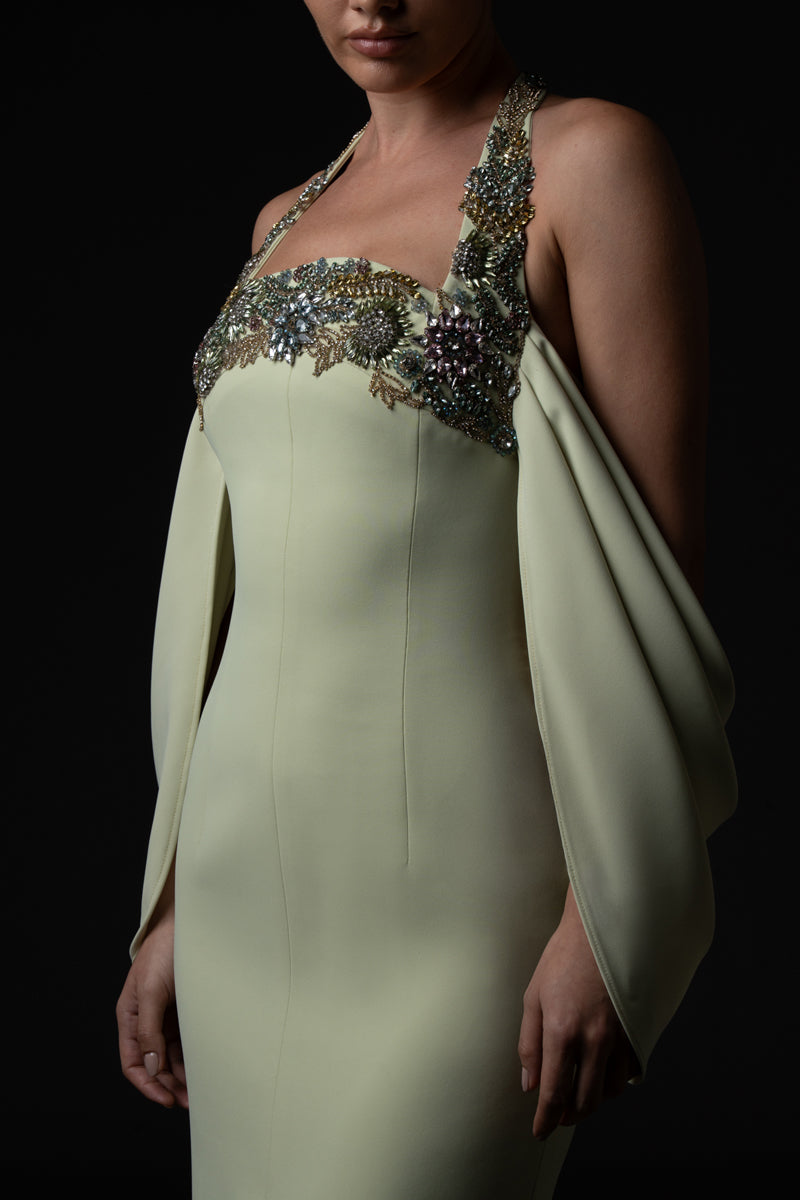 Light pistachio crêpe dress with front slit, featuring crystal floral embroidered neckline