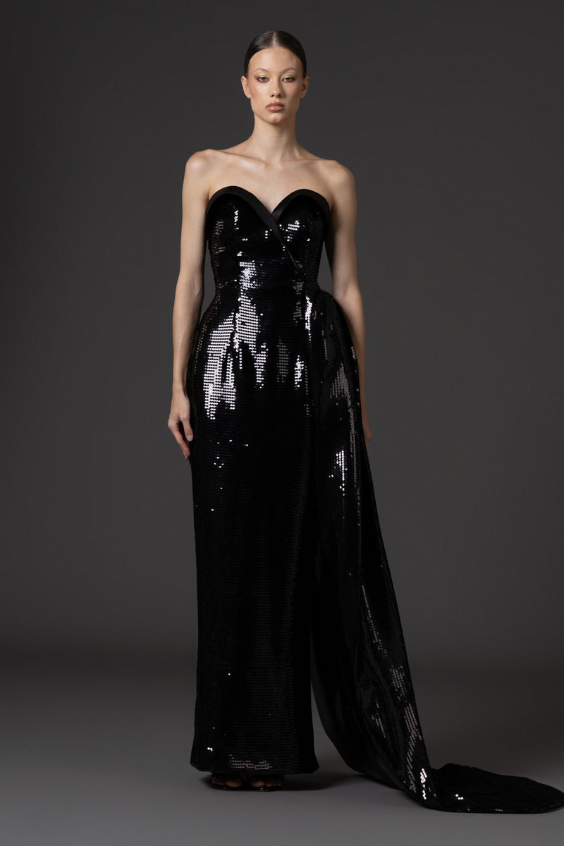 Strapless black sequin dress , featuring a one sided overskirt and a satin bustline