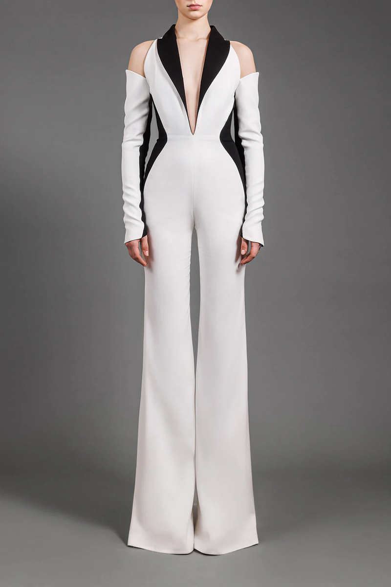 White crêpe jumpsuit with black collar and optical illusion detailing