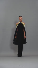 Black crêpe dress with embroidery and cape sleeves