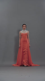 Coral crêpe dress with an embroidered neckline and a chiffon overskirt